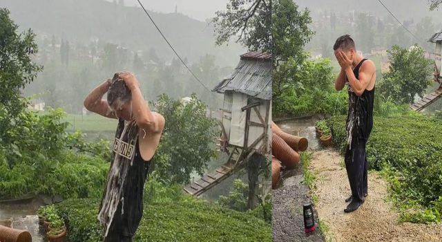 Rize’de sıcaktan bunalan genç yağmur altında duş aldı